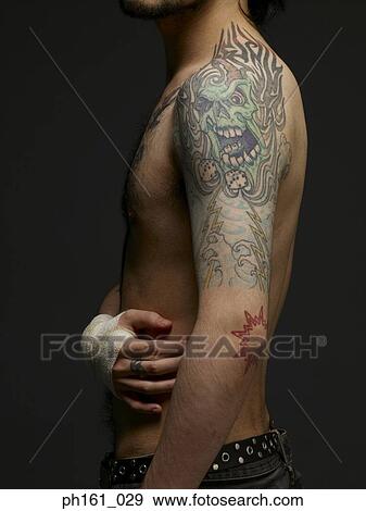 Bare chested young man, standing, side view View Large Photo Image Stock Photo - Bare chested young man, standing, side view. Fotosearch