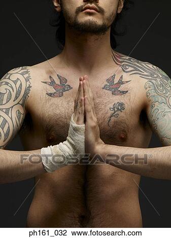 Bare chested young man with palms together, front view View Large Photo Image Stock Image - Bare chested young man with palms together, front view. Fotosearch
