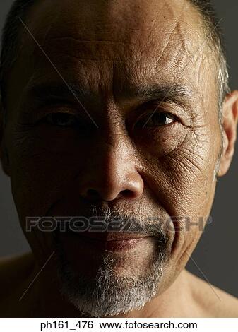 Close-up of a mature man View Large Photo Image Stock Photograph - Close-up of a mature man. Fotosearch