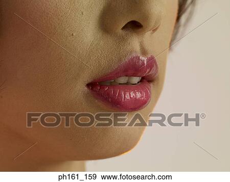 Close-up of a woman's lips View Large Photo Image Stock Photo - Close-up of a woman's lips. Fotosearch