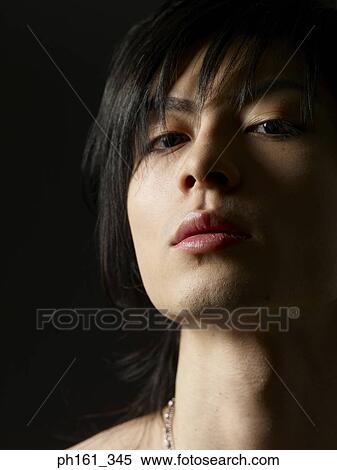 Close-up of a young man View Large Photo Image Stock Photography - Close-up of a young man. Fotosearch