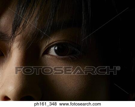Close-up of a young man's eye View Large Photo Image Stock Photo - Close-up of a young man's eye. Fotosearch
