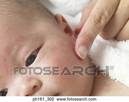 Close-up of an adult touching baby's face View Large Photo Image Stock Image - Close-up of an adult touching baby's face. Fotosearch