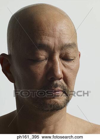Close-up of bald man with eyes closed View Large Photo Image Stock Photography - Close-up of bald man with eyes closed. Fotosearch