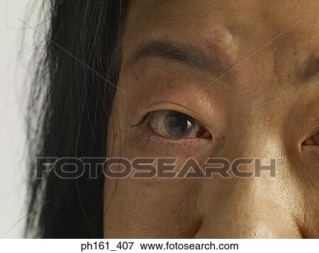 Close-up of mature woman's face View Large Photo Image Stock Photo - Close-up of mature woman's face. Fotosearch