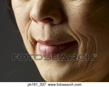 Stock Photo - Close-up of mature woman's mouth. Fotosearch