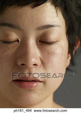 Close-up of woman, eyes closed View Large Photo Image Picture - Close-up of woman, eyes closed. Fotosearch
