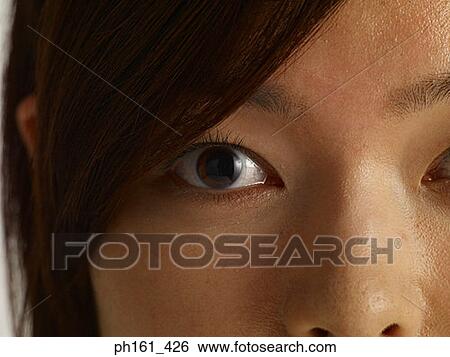 Close-up of woman's eyes View Large Photo Image Stock Photograph - Close-up of woman's eyes. Fotosearch