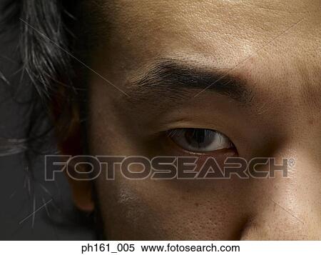 Close-up on the eye of a young man View Large Photo Image Stock Photography - Close-up on the eye of a young man. Fotosearch