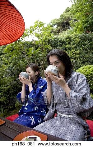 Couple enjoying a meal in the garden View Large Photo Image Stock Image - Couple enjoying a meal in the garden. Fotosearch