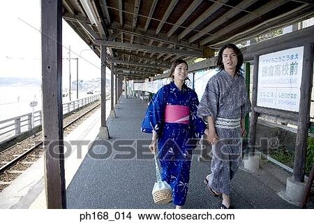 Picture - Couple in traditional Japanese clothing, walking. Fotosearch