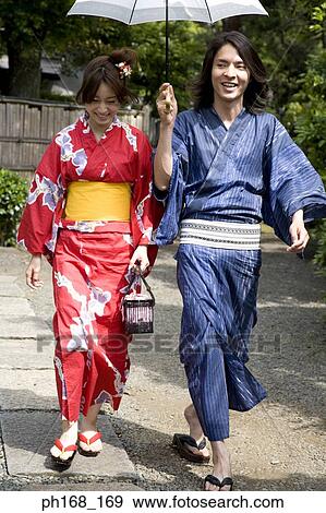 Couple in traditional Japanese clothing, walking View Large Photo Image Stock Photo - Couple in traditional Japanese clothing, walking. Fotosearch