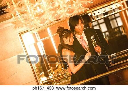 Couple relaxing by bar in cruise ship View Large Photo Image Stock Image - Couple relaxing by bar in cruise ship. Fotosearch