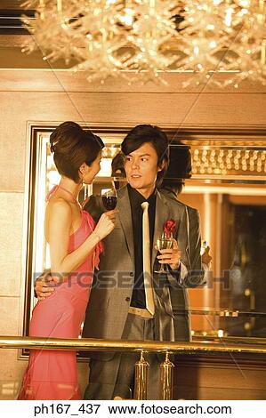 Stock Photo - Couple relaxing by bar in cruise ship. Fotosearch