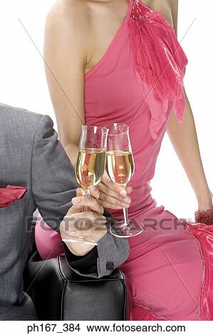 Picture - Couple toasting with champagne, close-up. Fotosearch