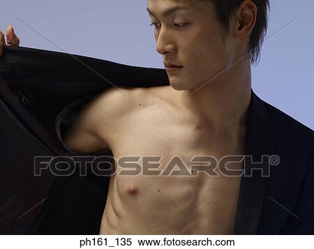 Stock Photography - Man holding jacket open. Fotosearch