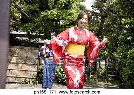 Stock Image - Man looking at woman running. Fotosearch