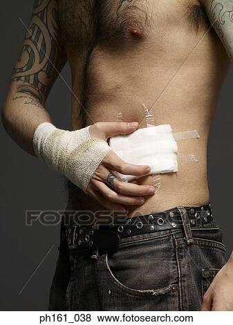 Man with bandages on his hand and torso View Large Photo Image Stock Photo - Man with bandages on his hand and torso. Fotosearch