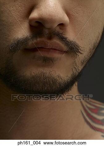 Man with goatee and tattoo, close-up View Large Photo Image Picture - Man with goatee and tattoo, close-up. Fotosearch