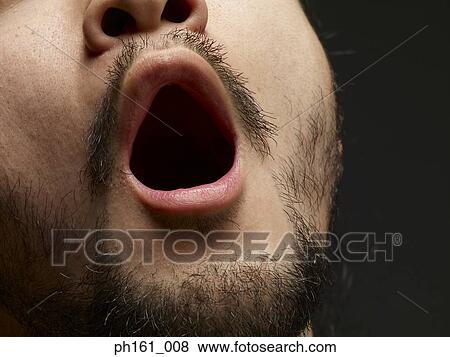 Man with mouth open, close-up View Large Photo Image Stock Photo - Man with mouth open, close-up. Fotosearch