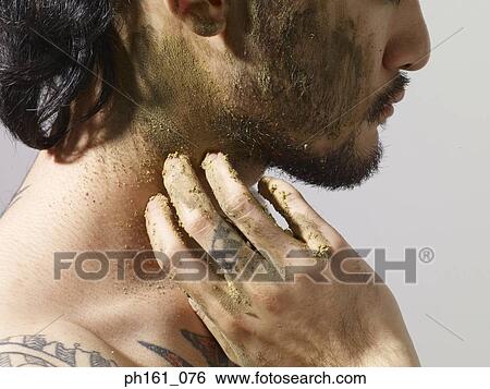Man with mud on his face View Large Photo Image Stock Photograph - Man with mud on his face. Fotosearch