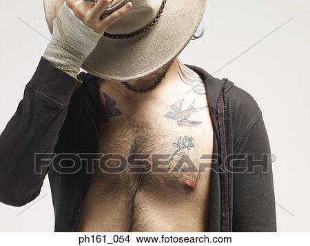Man with sweater unzipped and a hat View Large Photo Image Picture - Man with sweater unzipped and a hat. Fotosearch