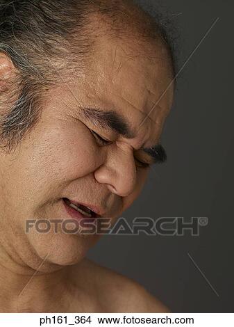 Mature man frowning, side view View Large Photo Image Picture - Mature man frowning, side view. Fotosearch