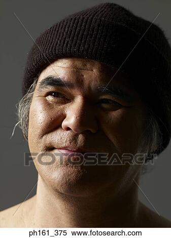 Mature man wearing a woollen cap View Large Photo Image Stock Photography - Mature man wearing a woollen cap. Fotosearch