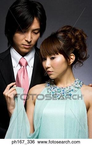 Portrait of a couple in formal attire View Large Photo Image Stock Photograph - Portrait of a couple in formal attire. Fotosearch