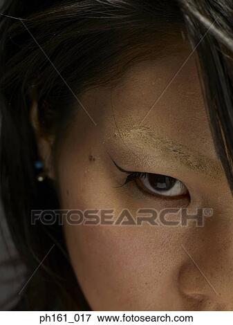 Stock Photo - Portrait of a young woman, close-up. Fotosearch