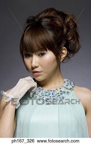 Stock Photograph - Portrait of a young woman. Fotosearch