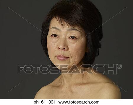 Portrait of mature woman, close-up View Large Photo Image Stock Image - Portrait of mature woman, close-up. Fotosearch