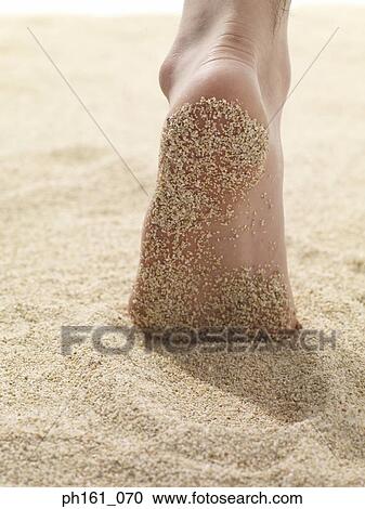 Stock Image - Sand on soles of feet. Fotosearch