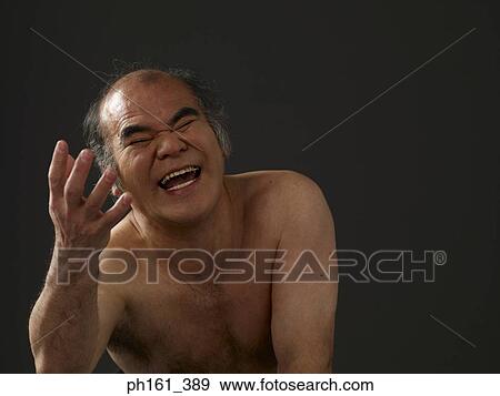 Shirtless man laughing with hand stretched out View Large Photo Image Stock Photo - Shirtless man laughing with hand stretched out. Fotosearch
