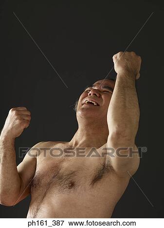 Shirtless man laughing, with head thrown back and hands in the air View Large Photo Image Stock Photo - Shirtless man laughing, with head thrown back and hands in the air. Fotosearch
