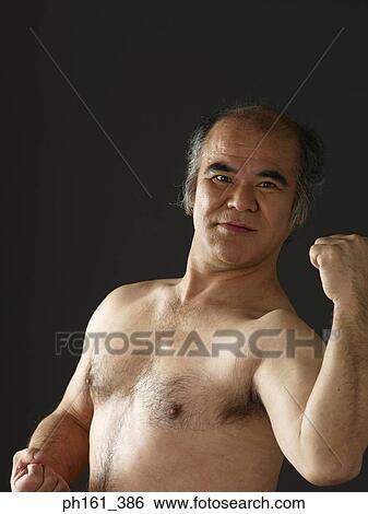 Shirtless mature man flexing his muscles View Large Photo Image Stock Photograph - Shirtless mature man flexing his muscles. Fotosearch