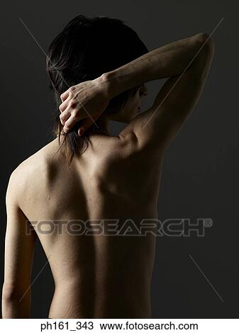 Stock Image - Shirtless young man, waist up, rear view. Fotosearch