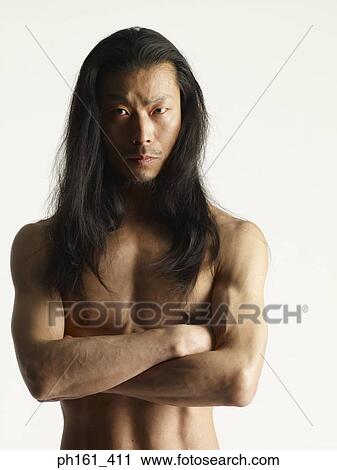 Shirtless Young Man With Long Hair Arms Folded Across Chest Stock
