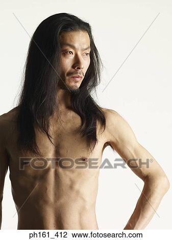 Shirtless young man with long hair, hand on hip View Large Photo Image Stock Image - Shirtless young man with long hair, hand on hip. Fotosearch