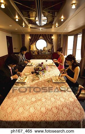 Stock Photography - Two couples enjoying a meal. Fotosearch