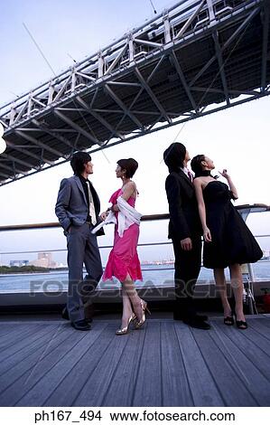 Two couples enjoying the view on cruise ship View Large Photo Image Picture - Two couples enjoying the view on cruise ship. Fotosearch