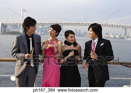 Two couples enjoying the view onboard a cruise ship View Large Photo Image Picture - Two couples enjoying the view onboard a cruise ship. Fotosearch