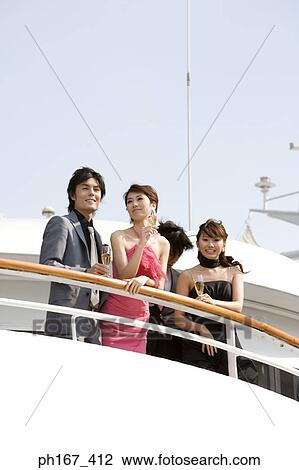 Two couples enjoying the view onboard a cruise ship View Large Photo Image Stock Image - Two couples enjoying the view onboard a cruise ship. Fotosearch