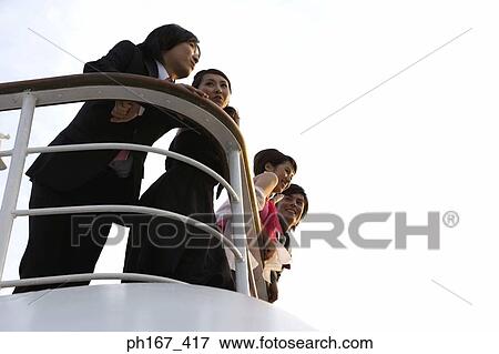 Two couples enjoying the view onboard a cruise ship View Large Photo Image Stock Photo - Two couples enjoying the view onboard a cruise ship. Fotosearch