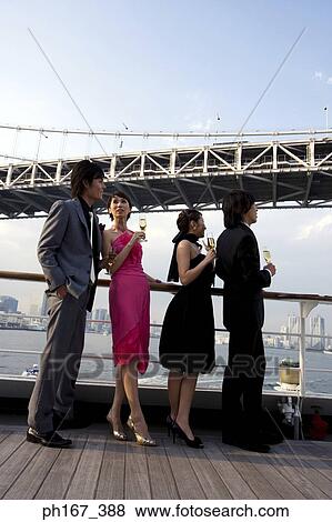 Two couples onboard a cruise ship View Large Photo Image Stock Photo - Two couples onboard a cruise ship. Fotosearch