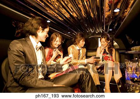 Two couples sitting in a limousine View Large Photo Image Stock Image - Two couples sitting in a limousine. Fotosearch