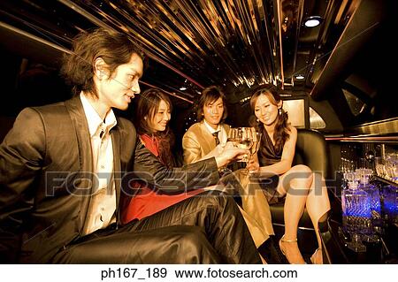 Two couples toasting inside a limousine View Large Photo Image Stock Photo - Two couples toasting inside a limousine. Fotosearch