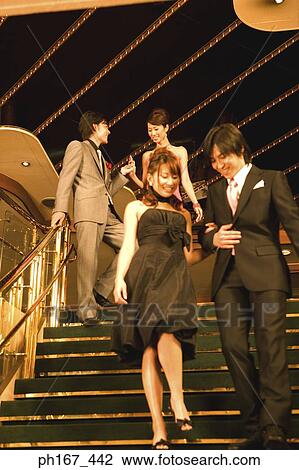 Two couples walking down steps of cruise ship View Large Photo Image Stock Image - Two couples walking down steps of cruise ship. Fotosearch