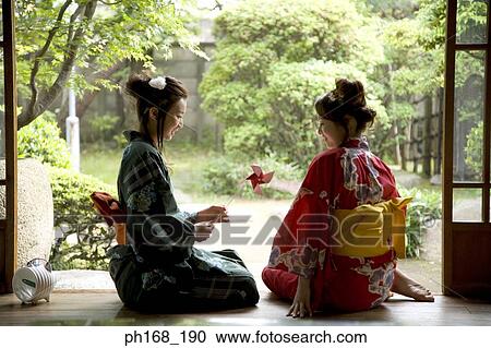 Two women in kimono sitting by corridor View Large Photo Image Stock Image - Two women in kimono sitting by corridor. Fotosearch