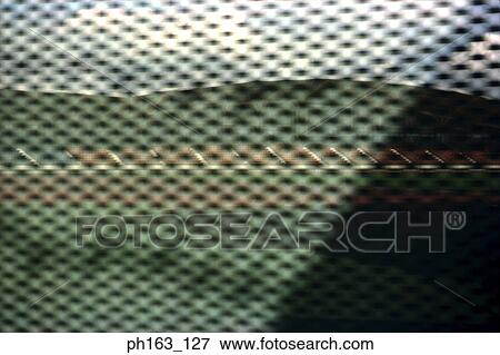 Stock Photo - View as seen from inside a vehicle with a shade. Fotosearch